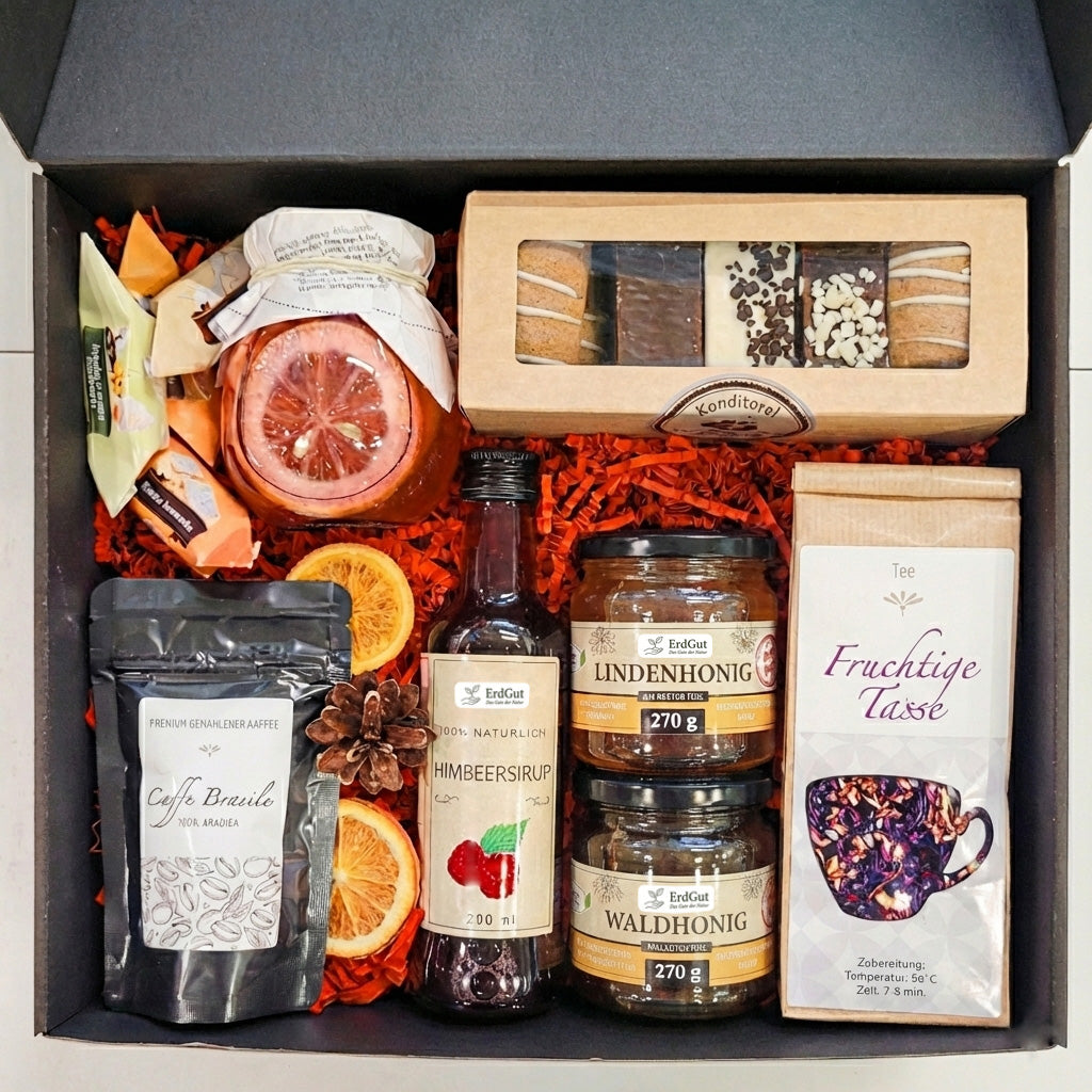Geschenkkorb mit Kaffee, Tee, Honig und Sirup