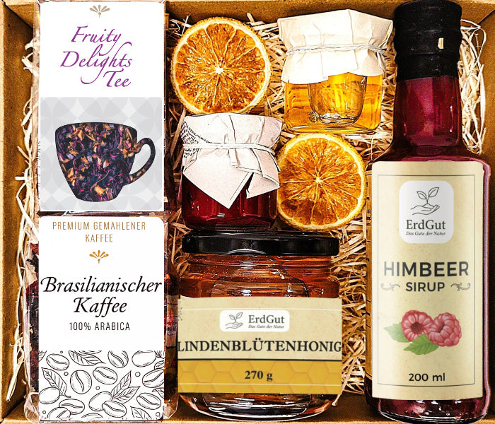 Geschenkkorb mit Kaffee, Tee, Sirup, Honig und Konfitüre