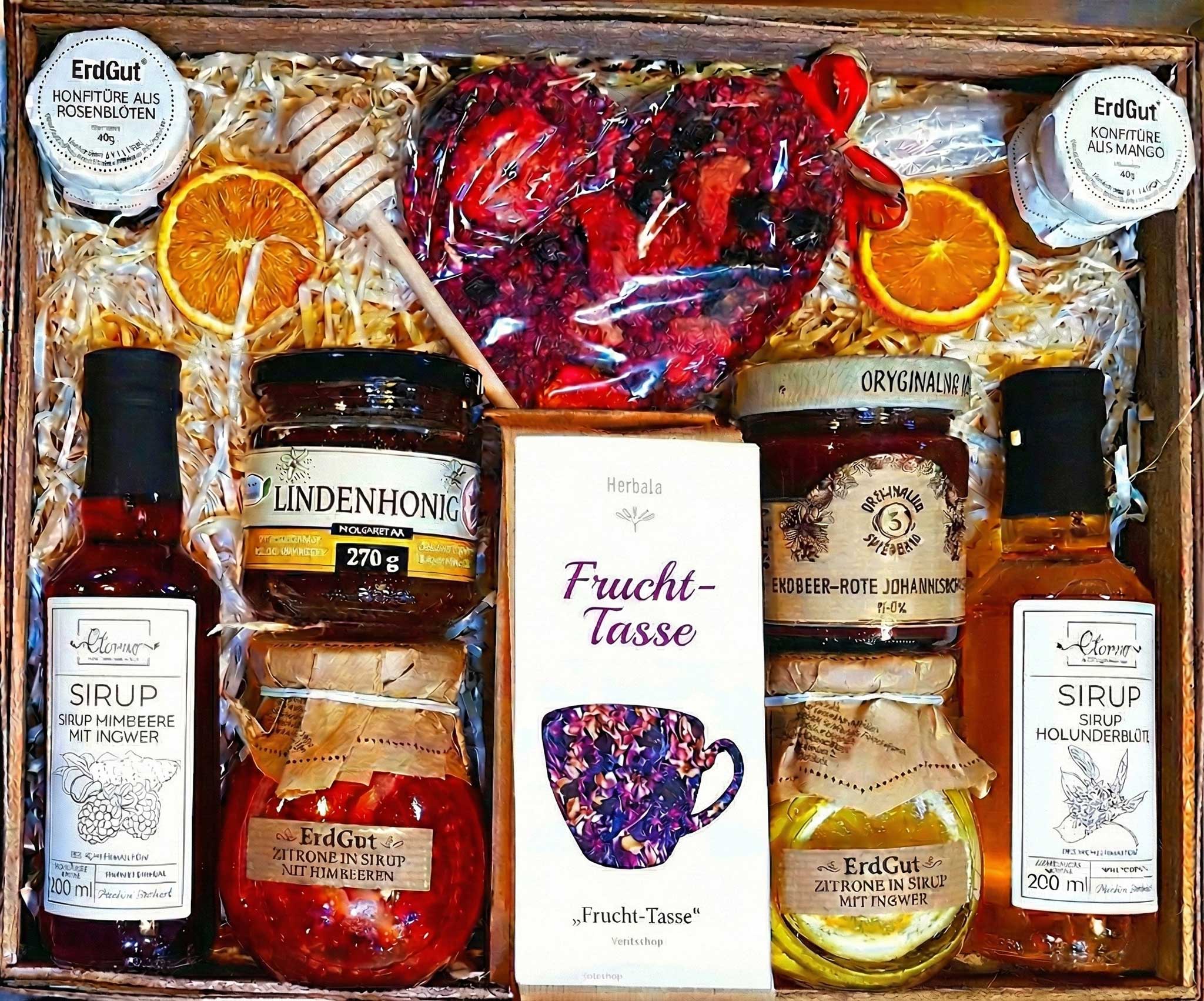 Geschenkkorb mit Tee, Sirup, Honig, Konfitüre und Herz-Schokolade