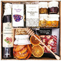 Geschenkkorb mit Kaffee, Tee, Schokolade, Sirup und Honig