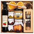 Geschenkkorb mit Sirup, Honig, Lebkuchen, Konfitüre und Zitronen in Sirup