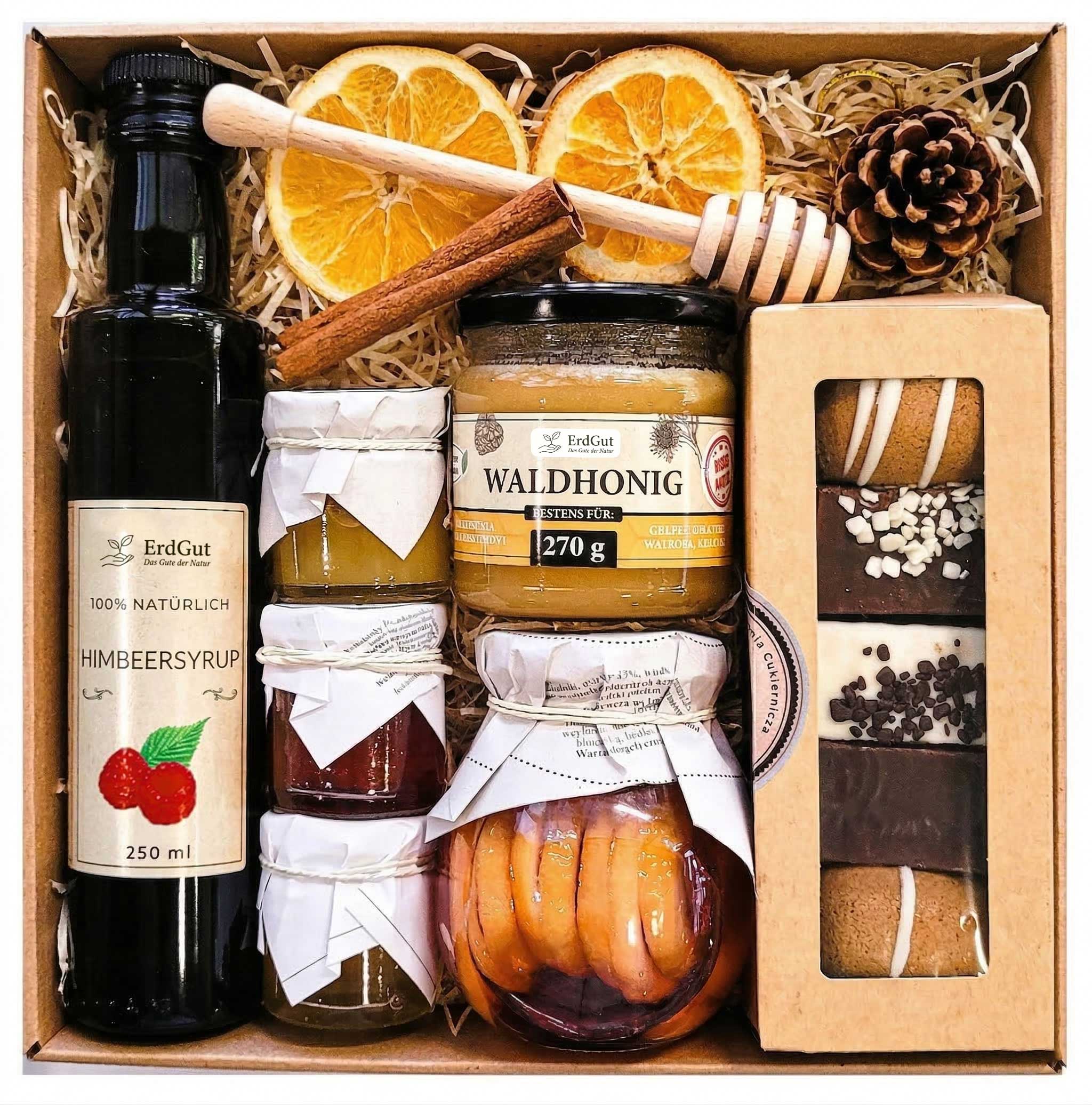 Geschenkkorb mit Sirup, Honig, Lebkuchen, Konfitüre und Zitronen in Sirup