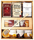 Geschenkkorb mit Tee, Kaffee, Honig und Lebkuchen